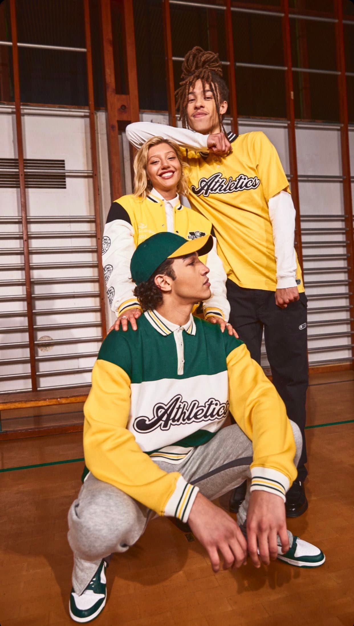 Model in a yellow and green Athletic sweatshirt